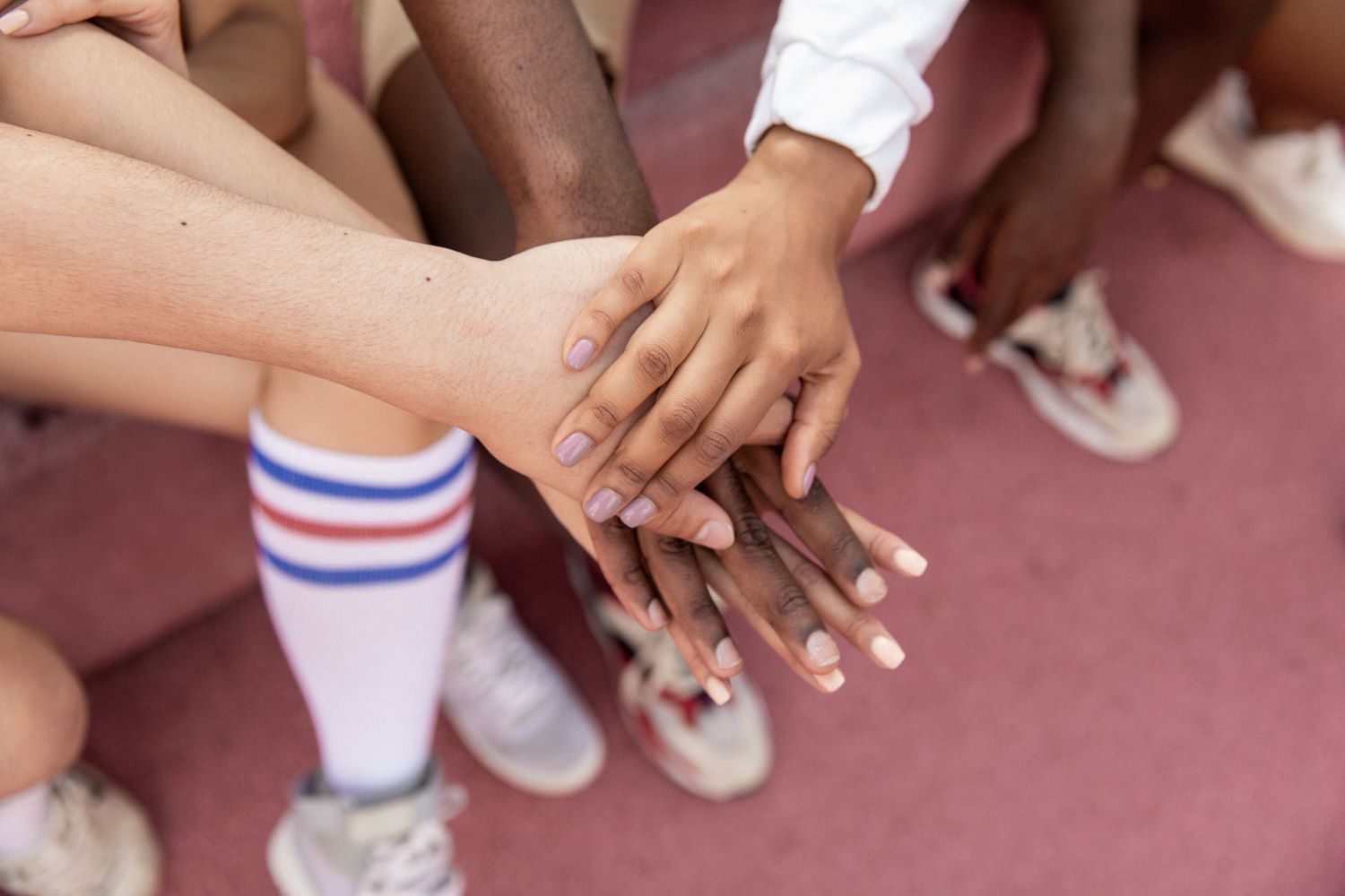 a picture of hands put together as if empowering each other